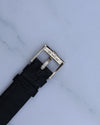 Side view of Piaget-signed white gold buckle on vintage leather strap, part of Ref. 9341 watch