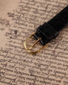 Original Audemars Piguet 18K yellow gold buckle on black leather strap, part of vintage skeleton watch ensemble