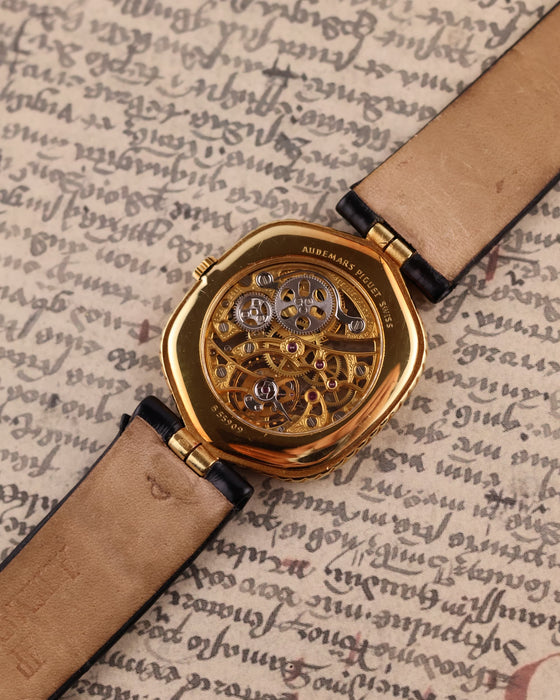 Rear view of Audemars Piguet skeleton watch with sapphire case back revealing engraved movement architecture