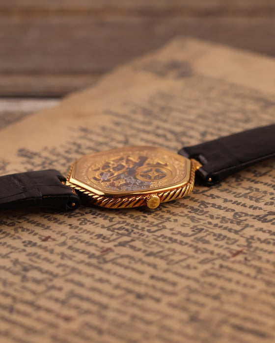 Crown-side view of Audemars Piguet 18K gold skeleton watch highlighting case shape and crown design