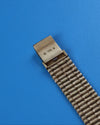Close-up of Audemars Piguet Bamboo bracelet with alternating smooth and textured gold finishe