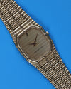 Ribbed gold-tone dial of Audemars Piguet Bamboo watch reflecting light in soft vertical wave