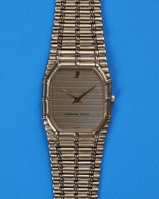 Semi-close view of AP Bamboo dial with gold-tone ribbed texture and minimalist hour markers