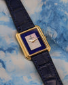 Vintage Corum gold tank watch on leather strap, highlighting elegant Art Deco proportions