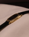 Side profile of Piaget watch highlighting the slim 18K yellow gold case and elegant lugs.
