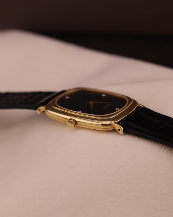 Close-up of the Piaget watch crown and case side, displaying fine finishing and slim profile.
