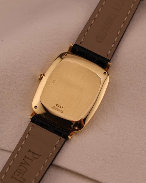 Rear view of the Piaget watch showing the solid gold caseback with hallmarks and minimal wear.