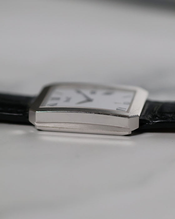 Profile view of Piaget Ref. 26354 highlighting slim case, fluted sides, and integrated lugs.