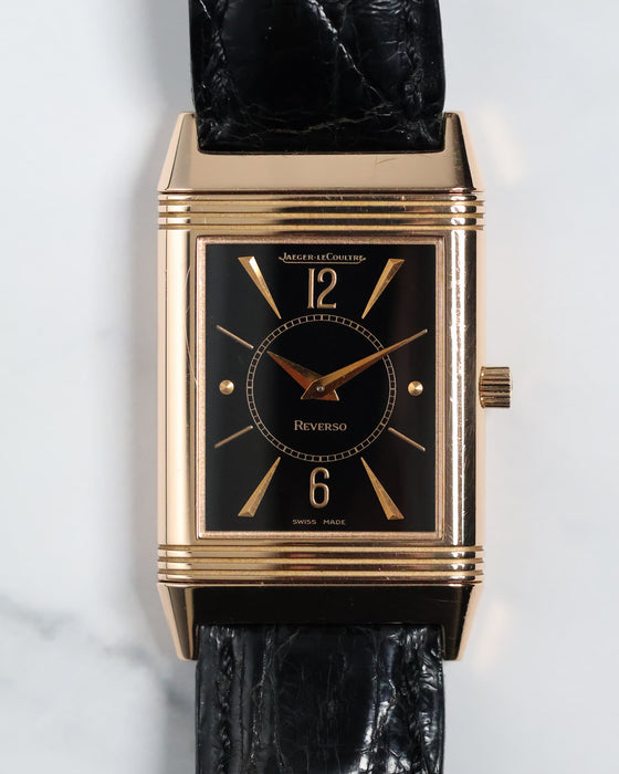Front view of Jaeger-LeCoultre Reverso 250.2.86 in 18K rose gold with rare black dial and gilt markers.