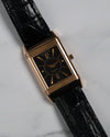 Lifestyle shot of the Reverso watch with vintage background, showing elegant proportions.
