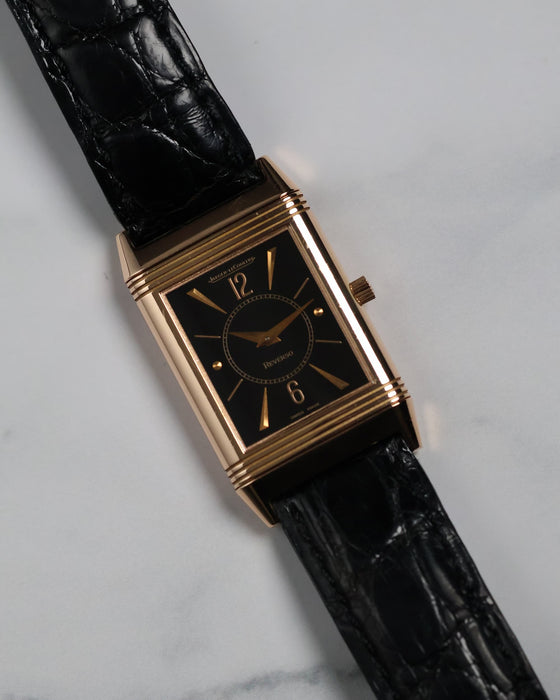 Lifestyle shot of the Reverso watch with vintage background, showing elegant proportions.