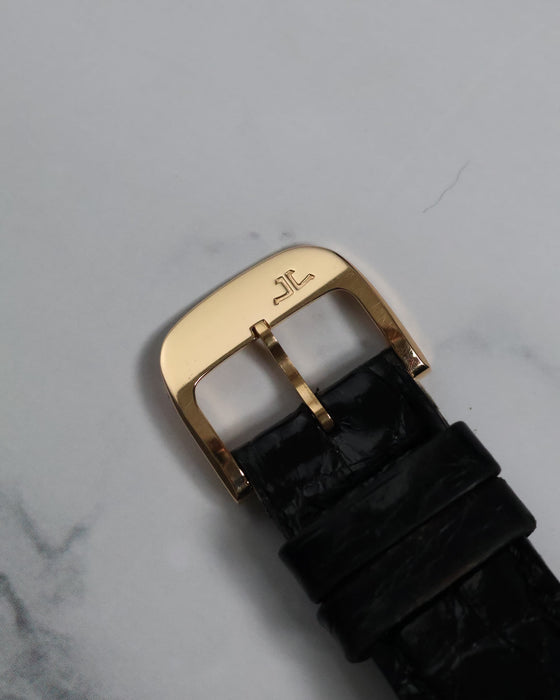 Top view of the original Jaeger-LeCoultre 18K rose gold buckle with engraved logo.