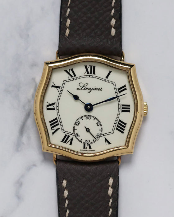 Front view of the 1970s Longines watch with distinctive Sympathie-style gold-plated case and Roman numeral dial.