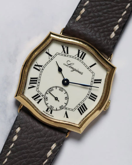 Angled overview of the Longines Sympathie-style watch showcasing its sculptural lugs and elegant proportions.