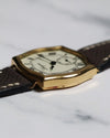 Profile view of the Longines watch showing the unique case curvature and acrylic crystal dome.