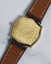 Rear view of the gold-plated caseback with vintage patina, showcasing the watch’s clean and classic design.
