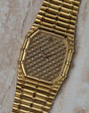 Close-up of Audemars Piguet Bamboo 27mm showcasing the full pavé diamond dial and bamboo-style gold case.