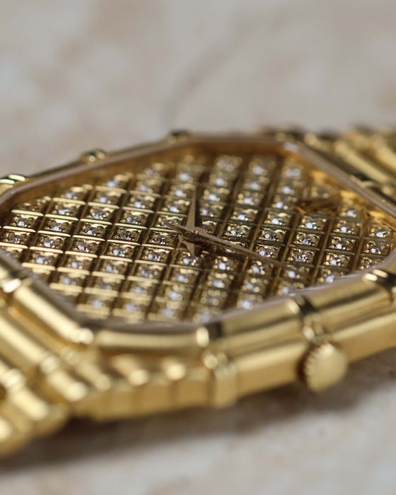 Side profile of Audemars Piguet Bamboo 27mm highlighting the signed crown and bamboo-textured case.