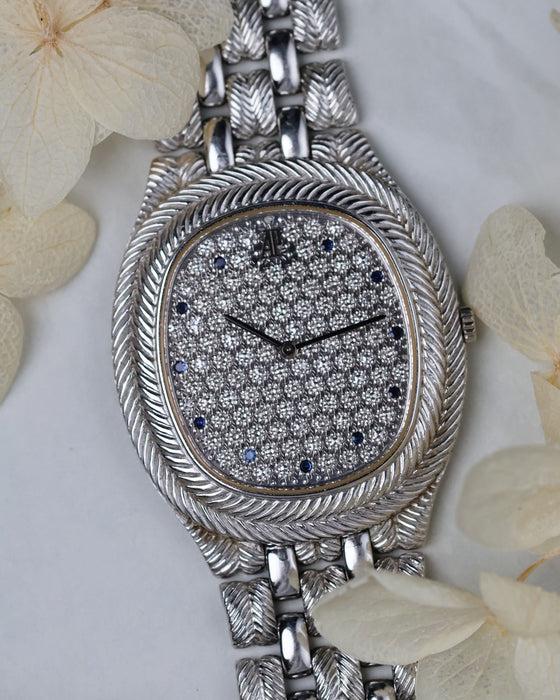 Angled shot highlighting the engraved white gold bracelet and slim profile of the Audemars Piguet Feather.