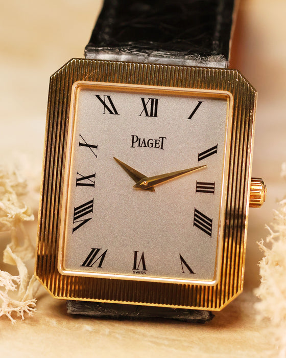 Silver dial of Piaget Protocole Jumbo 90154 with bold black Roman numerals and dauphine hands.