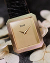 Piaget Protocole 90154 in 18K yellow gold with vertical tapestry dial on black leather strap.