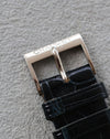 Original Chaumet 18K white gold buckle, top view on alligator strap.