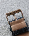 Chaumet white gold buckle underside with hallmark, attached to strap.