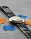 Chaumet Dress Watch Ref. 12A, low angle showing polished white gold case and lugs.