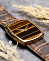 Low-angle view highlighting the slim profile and Tiger’s Eye stone dial of the Piaget Ref. 9741