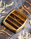Vintage Piaget 9741 watch in yellow gold with original gold buckle, displayed on strap