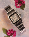 Cartier Santos Galbée Ref. 1565 angled view highlighting polished bezel and Roman numerals