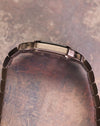 Cartier Santos Galbée Ref. 1565 side profile displaying slim stainless steel case and bracelet integration