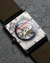 Macro shot of the transparent caseback showcasing the mechanical movement, a rare feature for Concord watches of this era.