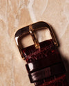 Original 18k rose gold Audemars Piguet buckle, top view, attached to leather strap