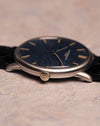 Side profile of the Vacheron Constantin Ref. 2006 focusing on the signed crown and thin lugs of the white-gold case.