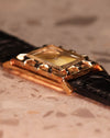 Macro shot of the LeCoultre watch focusing on the layered bezel architecture and elegant Art Deco numerals.