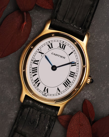 Front view of the Cartier Arcade LM Ref. 9605 with a white Roman numeral dial and 18k yellow gold case.