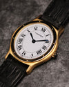 Angled front view of the Cartier Arcade LM Ref. 9605 highlighting its slim gold case and white dial.