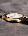 Side profile of the Cartier Arcade LM Ref. 9605 displaying the slim 18k yellow gold case.