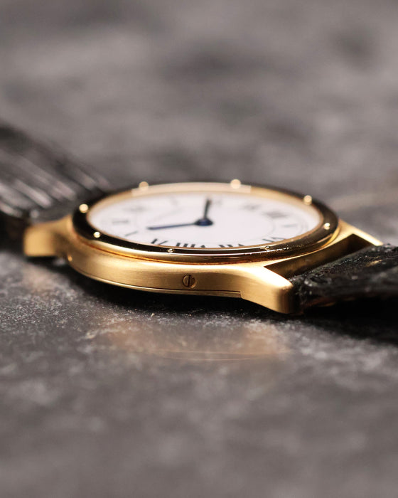 Side profile of the Cartier Arcade LM Ref. 9605 displaying the slim 18k yellow gold case.