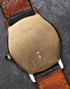 Caseback of the Cartier Arcade LM Ref. 9605 in 18k yellow gold showing Cartier engravings and brushed finish.