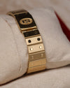 Close-up of the Cartier Santos Carrée Ref. 2960 bracelet clasp in 18K yellow gold, showing the brushed finish, signature Santos screws, and Cartier logo on the clasp.