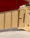 Close-up of the inner bracelet links near the clasp of the Cartier Santos Carrée, showing the engraved serial number on the 18K gold link.