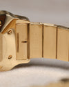Detailed view of the serial engraving on the inside of the Cartier Santos Carrée bracelet link, emphasizing the crisp markings and brushed gold finish.