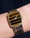 Piaget Ref. 9741 in 18K yellow gold with horizontal Tiger’s Eye dial worn on wrist