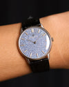 Close-up wrist shot of of the Vacheron Constantin Ref. 2006 showing the titanium blue mosaic dial.