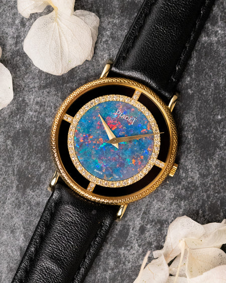 Piaget Ref. 9026 opal dial watch in 18K yellow gold with factory diamond bezel and onyx surround, front view