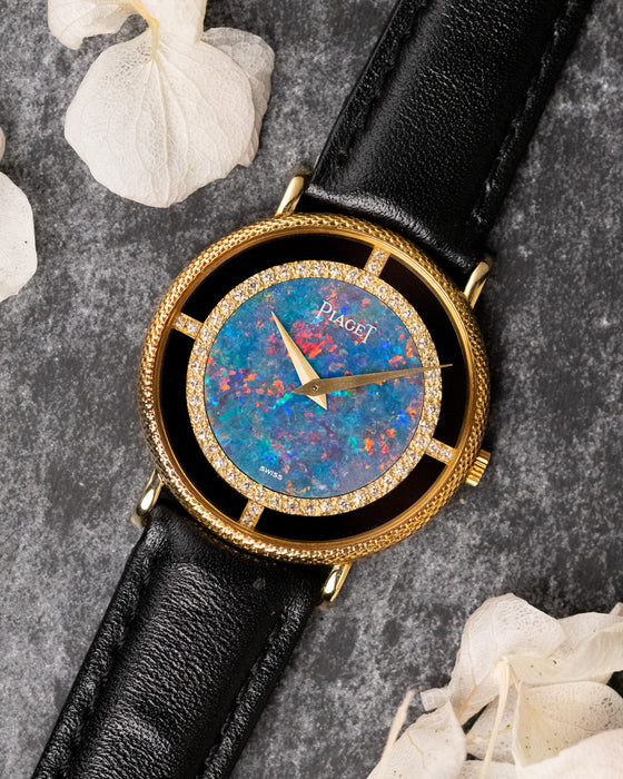 Piaget Ref. 9026 opal dial watch in 18K yellow gold with factory diamond bezel and onyx surround, front view