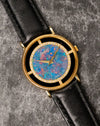Piaget Ref. 9026 opal dial showing vivid blue, green, and fiery orange colour play with gold dauphine hands