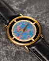 Angled close-up of Piaget Ref. 9026 highlighting textured 18K yellow gold case and opal dial
